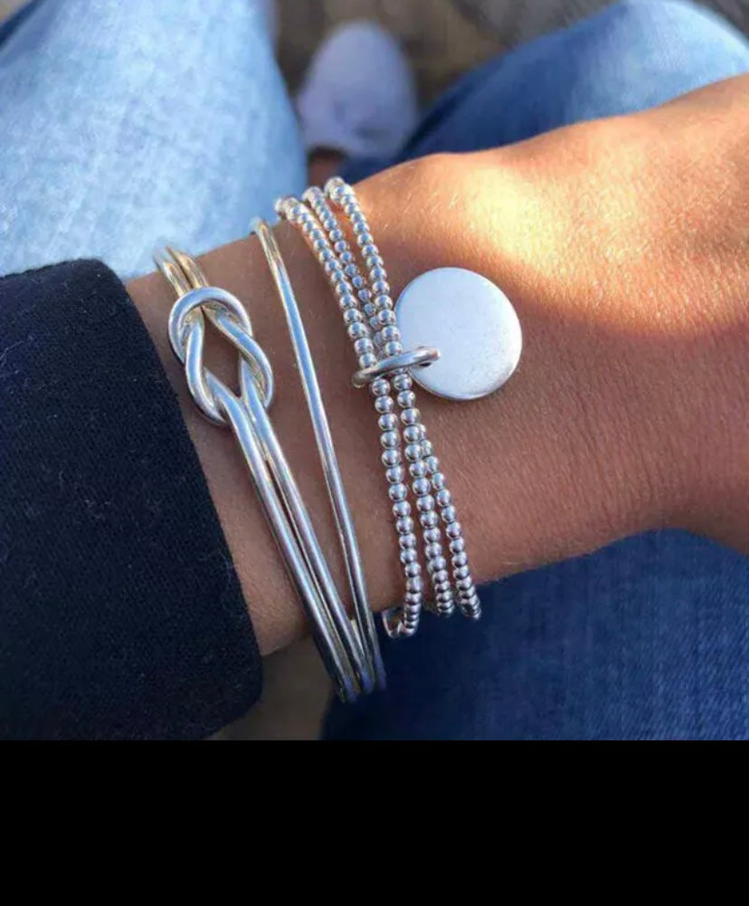 Stacked silver fashion jewelry bracelets